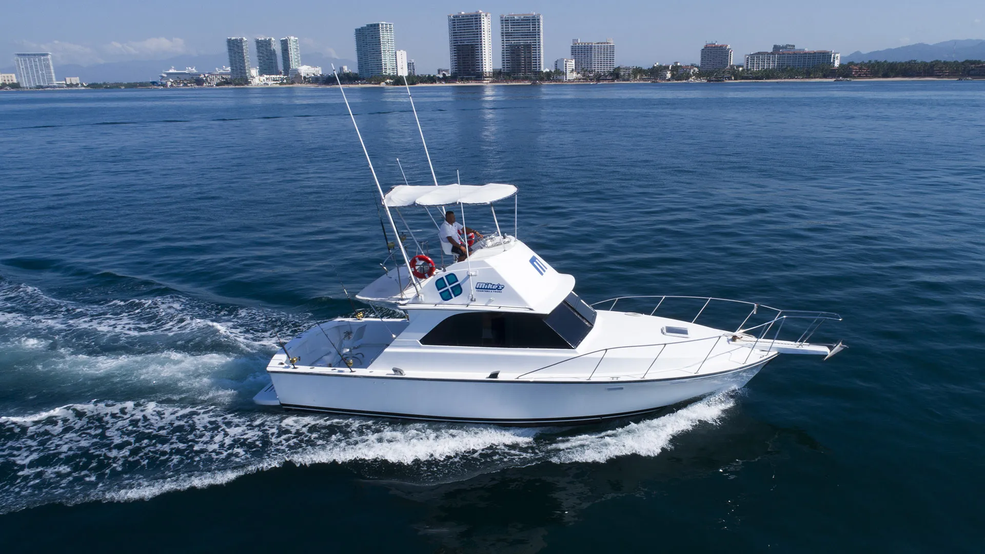 Nicolle 38-foot Bertram-style fishing boat cruising Banderas Bay off Puerto Vallarta