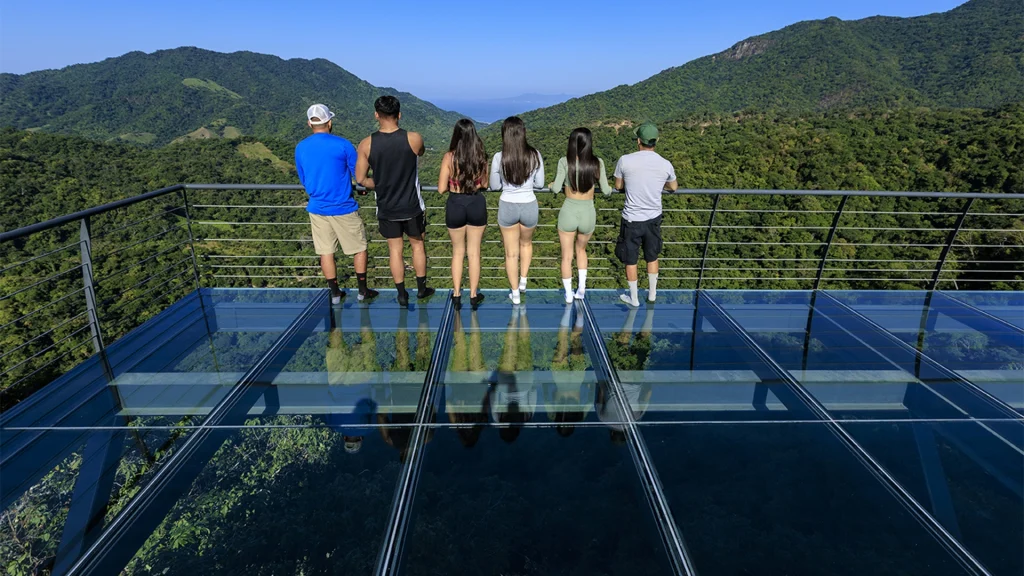 Guests overlooking the Sierra Madre from the glass platform at Jorullo Point near Puerto Vallarta