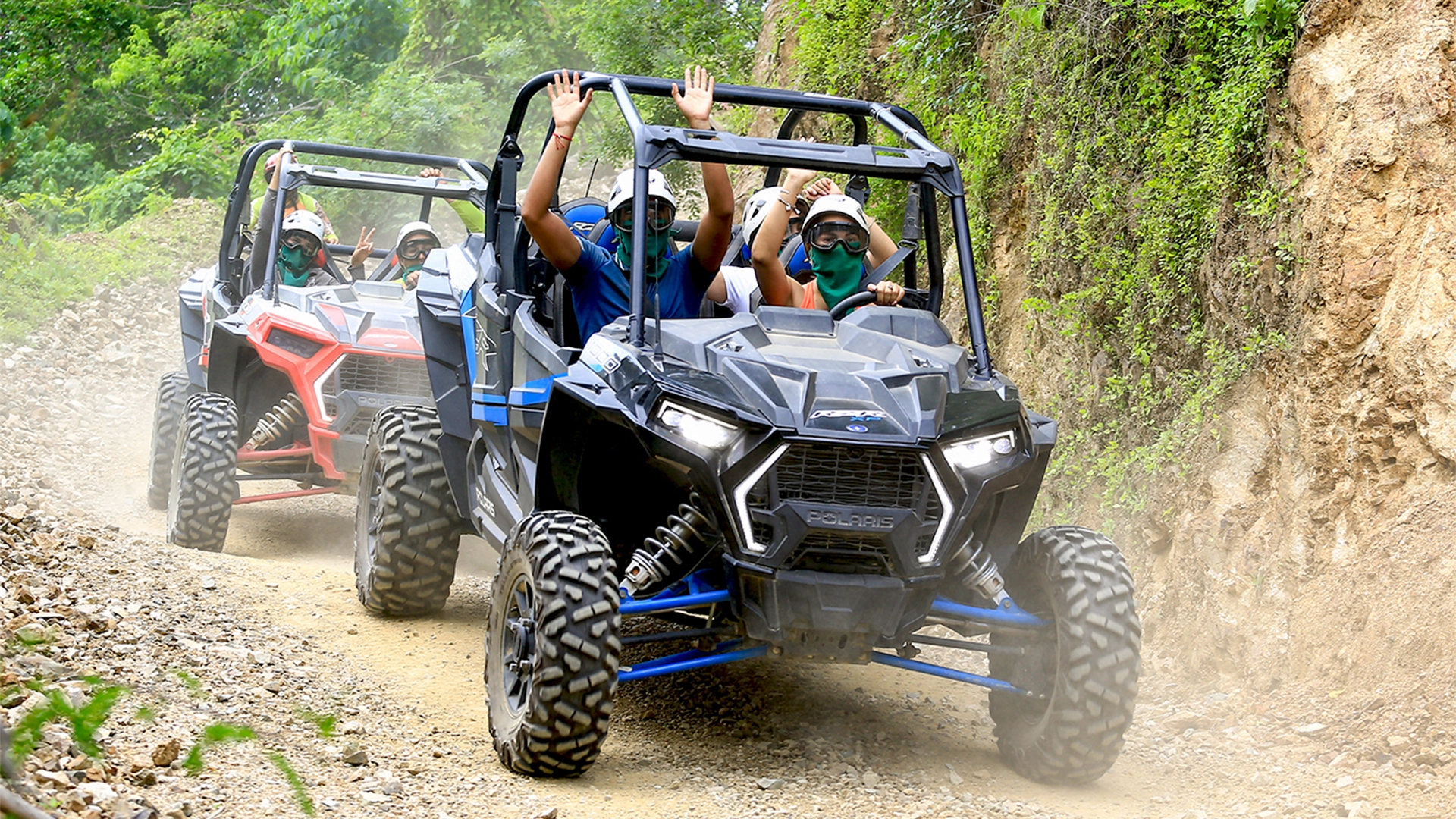 Guests driving Polaris RZRs on a rugged jungle trail during the River Park RZR Tour near Puerto Vallarta