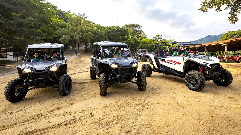 Guests in Polaris RZRs during the River Park RZR and Zipline Tour near Puerto Vallarta