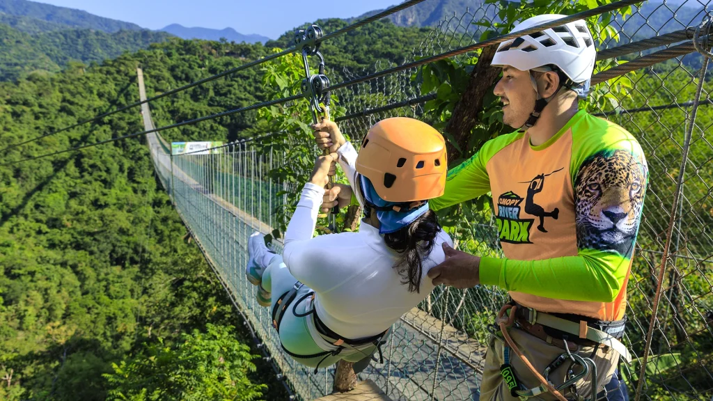 Guest starting the River Park zipline adventure in Puerto Vallarta with a guide